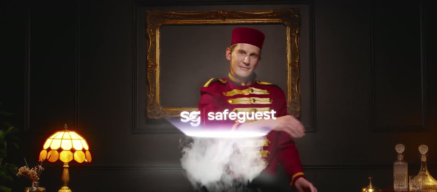 The bellhop sweeping deposits and paperwork into the Safeguest system